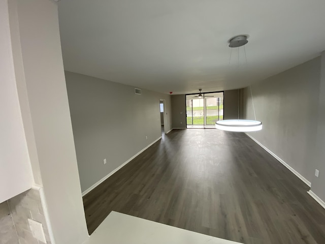 15324 Lakes Of Delray Blvd Unit 104, Delray Beach, FL 33484 - empty room with dark wood-style floors and baseboards