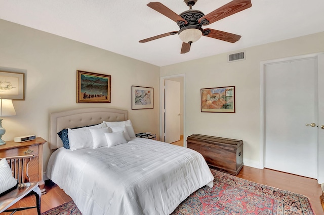 bedroom featuring wood-type flooring and ceiling fan