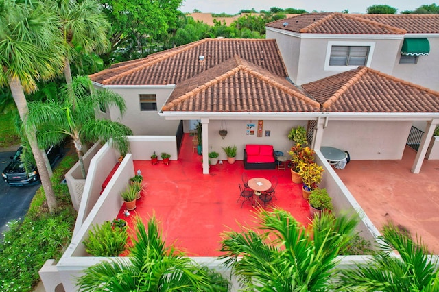 mediterranean / spanish-style home featuring a patio area