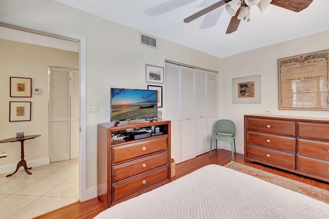 bedroom featuring light hardwood / wood-style flooring and ceiling fan