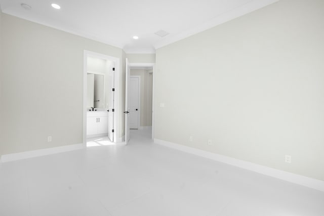 unfurnished room featuring light tile patterned flooring and ornamental molding