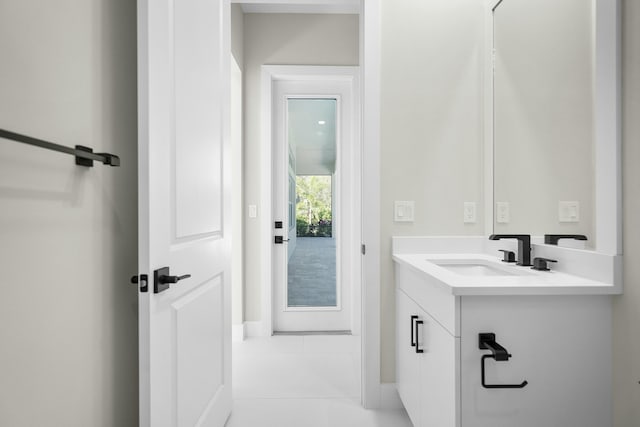 bathroom with vanity and tile patterned flooring