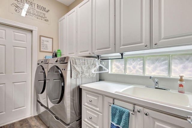 clothes washing area with separate washer and dryer, cabinet space, and dark wood-style floors