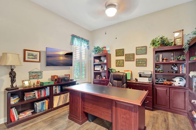 office space with light wood-type flooring and ceiling fan