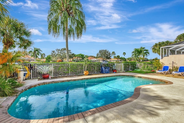 view of pool with a lanai and a patio