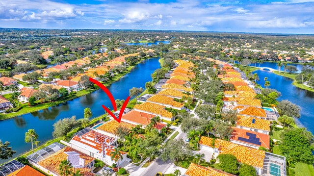 aerial perspective of suburban area featuring a nearby body of water