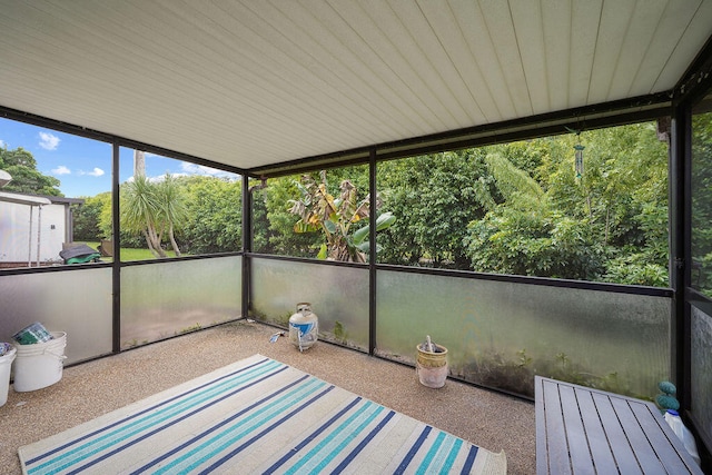 unfurnished sunroom with plenty of natural light