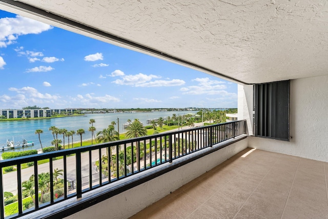 balcony featuring a water view