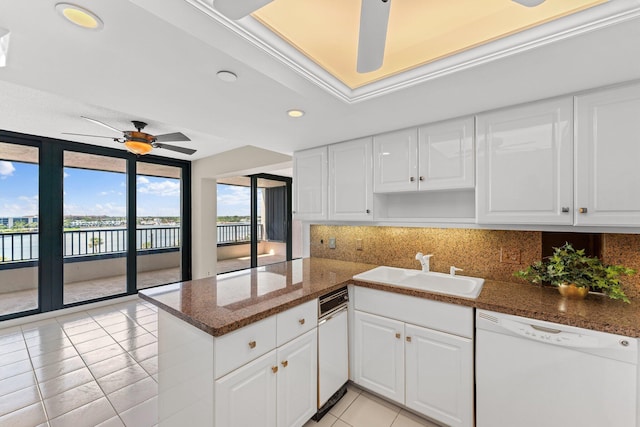 19900 Beach Rd Unit 603, Jupiter, FL 33469 - kitchen featuring white dishwasher, a sink, light tile patterned floors, a ceiling fan, and a water view