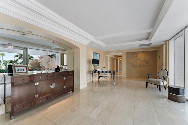 sitting room featuring crown molding, a tray ceiling, and light tile patterned floors