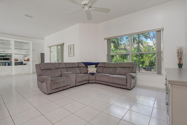 living room featuring light tile patterned flooring and ceiling fan