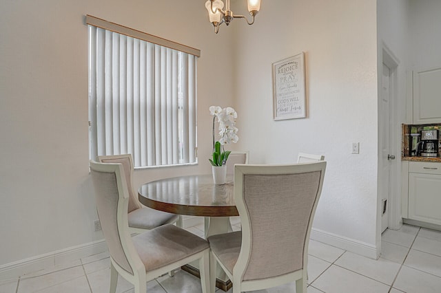 dining room featuring a chandelier and light tile patterned floors