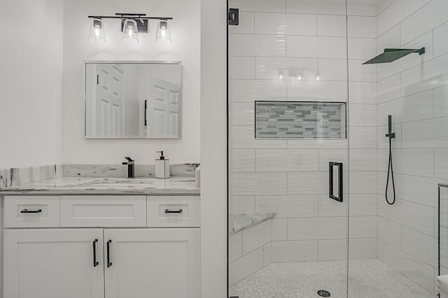 bathroom featuring vanity and walk in shower