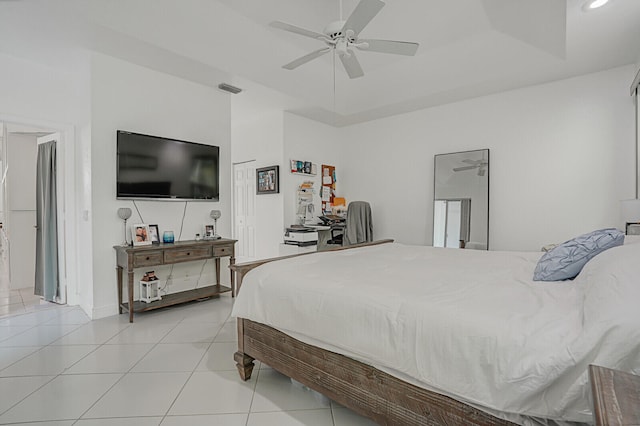 tiled bedroom with ceiling fan