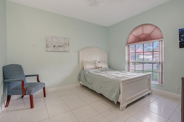 bedroom with light tile patterned floors and ceiling fan