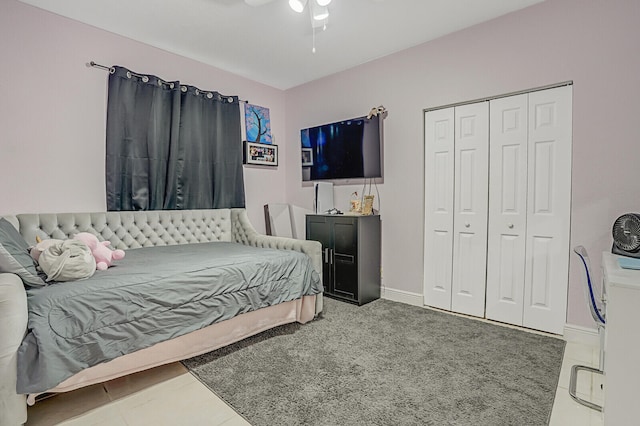 tiled bedroom with a closet