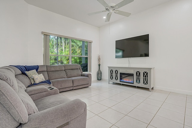 living room with ceiling fan and light tile patterned floors