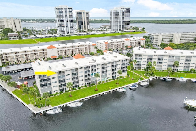 birds eye view of property with a water view