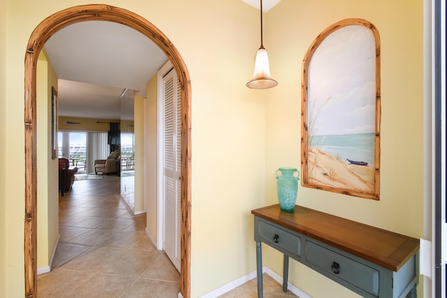 corridor featuring light tile patterned floors