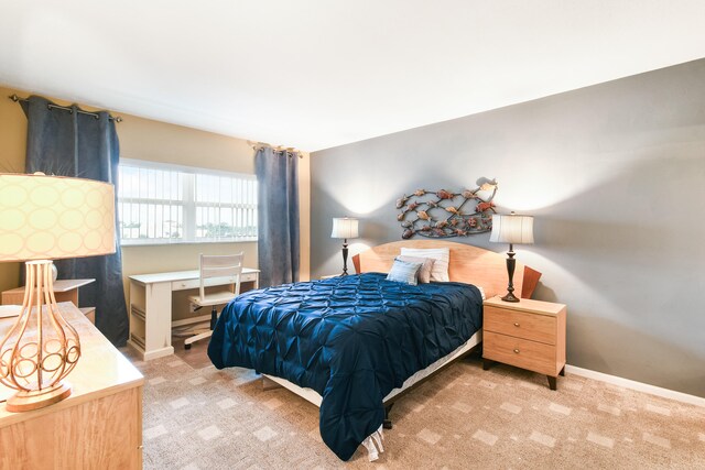 bedroom with light colored carpet