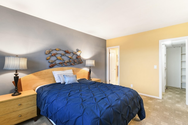 bedroom featuring light carpet