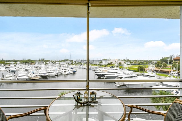 balcony featuring a water view