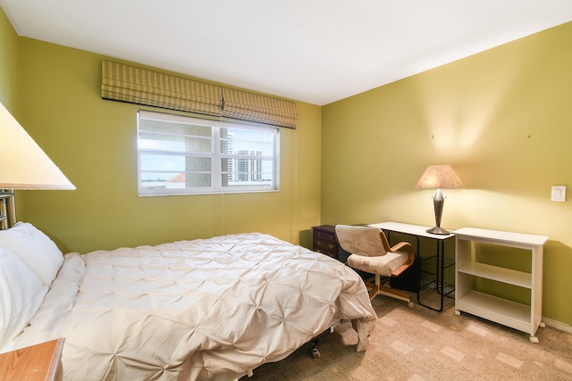 bedroom with light colored carpet