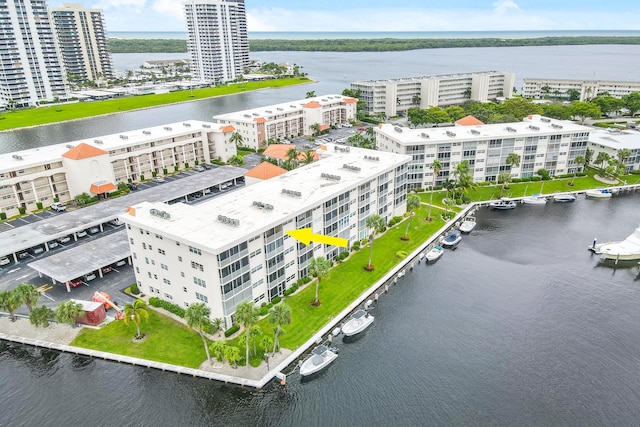 birds eye view of property with a water view