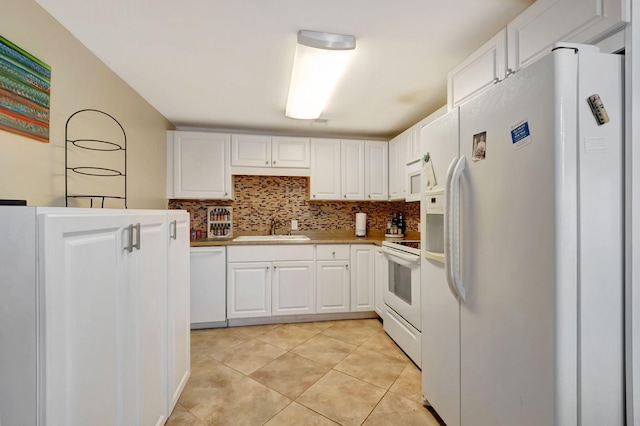 kitchen featuring sink, white cabinetry, decorative backsplash, and white appliances