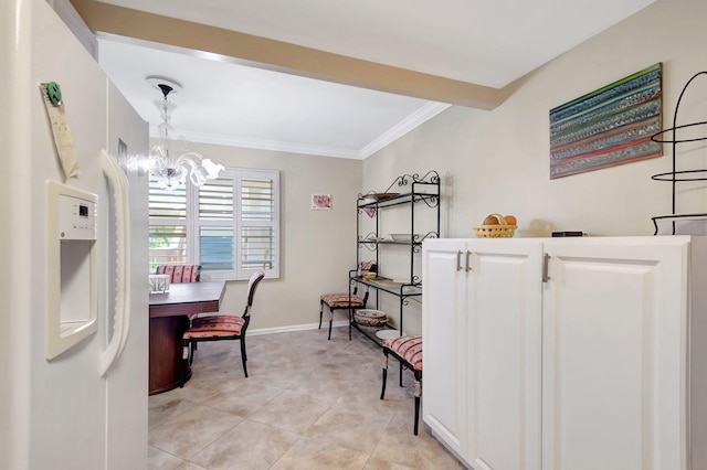 tiled dining space featuring a notable chandelier and crown molding