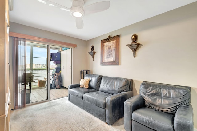 living room featuring light carpet and ceiling fan