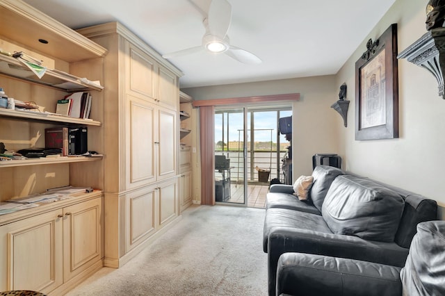 living room with light carpet and ceiling fan