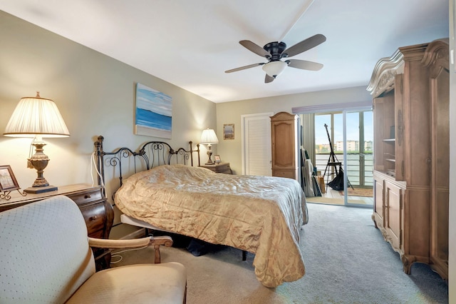 bedroom with access to exterior, light colored carpet, and ceiling fan