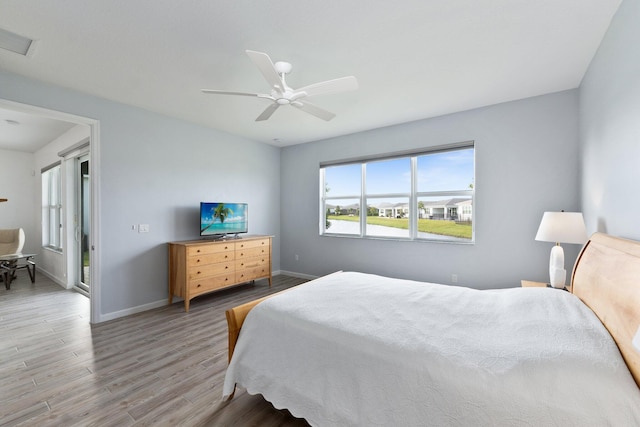 bedroom featuring wood-type flooring and ceiling fan