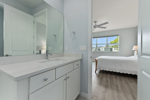 bathroom featuring vanity, wood-type flooring, and ceiling fan