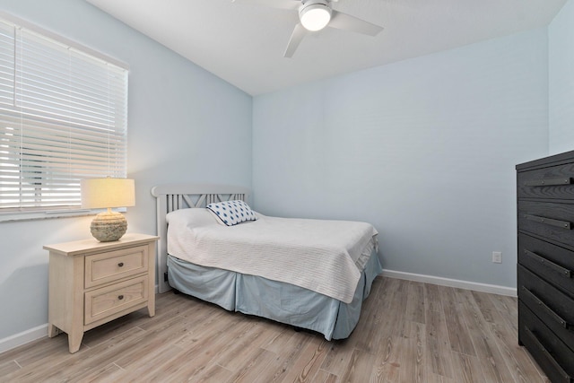 bedroom featuring light hardwood / wood-style floors and ceiling fan