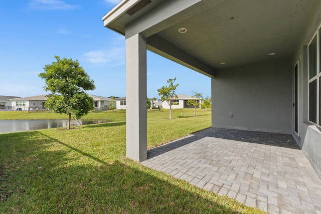 view of patio / terrace with a water view