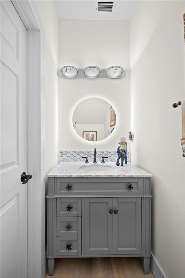 bathroom featuring vanity and hardwood / wood-style flooring