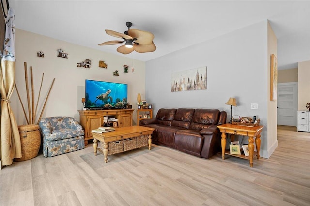 living room featuring light hardwood / wood-style floors and ceiling fan