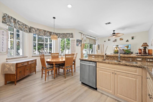 kitchen featuring ceiling fan, dishwasher, pendant lighting, light hardwood / wood-style floors, and sink