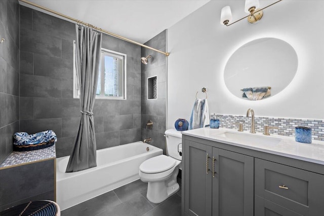 full bathroom with toilet, tile patterned floors, shower / bath combo with shower curtain, vanity, and decorative backsplash