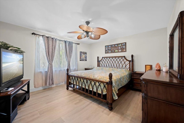 bedroom with ceiling fan and light wood-type flooring