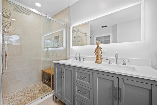 bathroom with vanity, tile patterned floors, and an enclosed shower