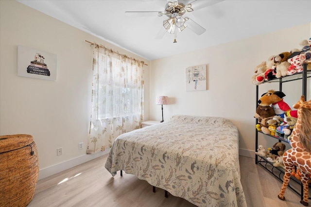 bedroom featuring wood-type flooring and ceiling fan