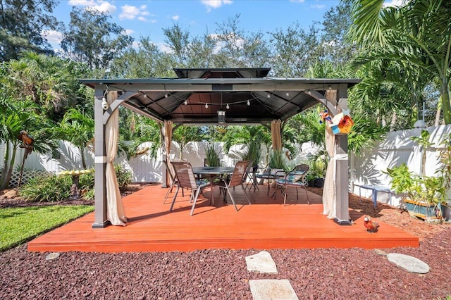 view of patio featuring a gazebo and a deck