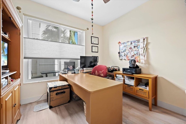 office area with a wealth of natural light and light hardwood / wood-style floors