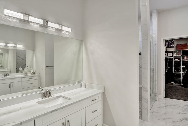 bathroom with a shower with door and vanity