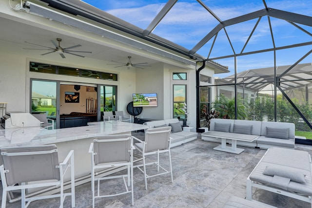 view of patio with outdoor lounge area, a bar, a lanai, and ceiling fan