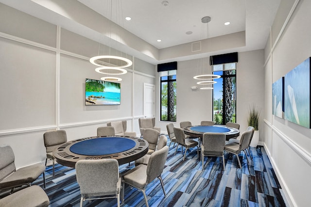 dining room with a chandelier and a tray ceiling