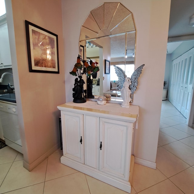 interior details with white dishwasher and sink